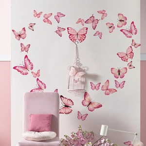 Pink butterfly wall decals arranged in a heart shape for elegant home nursery decor