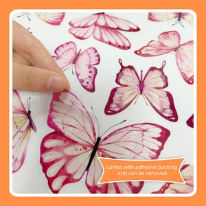 Detail of pink watercolor butterfly wall decal being peeled from adhesive backing