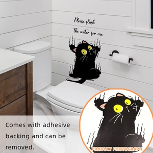 Detail of cartoon black cat toilet sticker with 'Please flush' text and adhesive backing