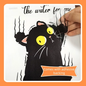 Detail of cartoon black cat wall sticker showing the adhesive backing for easy application