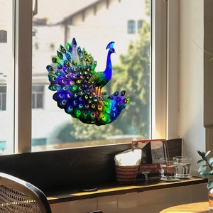 Vibrant peacock window decal with holographic laser gradient colors on glass surface