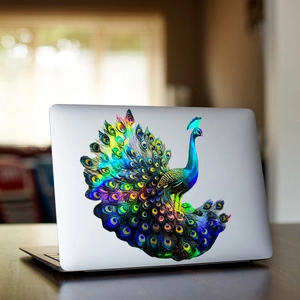 Iridescent laser peacock wall sticker with gradient colors on a silver laptop back