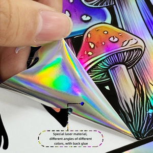 Close-up of holographic mushroom sticker showing color shift and adhesive backing