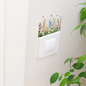 Vibrant wildflower wall decals with butterflies surrounding a white light switch cover