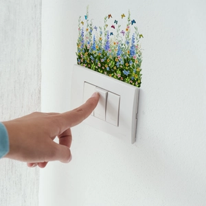 Self-adhesive floral wall stickers with blue flowers and butterflies for light switch decor