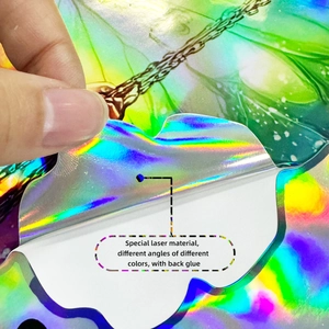 Detail of holographic laser butterfly sticker showing iridescent colors and adhesive backing