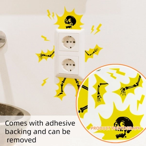 Close-up of electric shock skeleton wall sticker with lightning bolts on power outlet