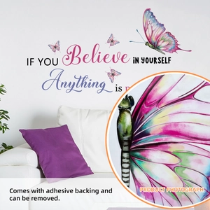 Detail of purple butterfly wall decal with Believe in Yourself quote on a white sofa wall