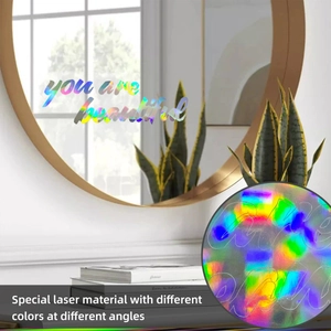 Close-up of laser holographic sticker with you are beautiful text on mirror surface