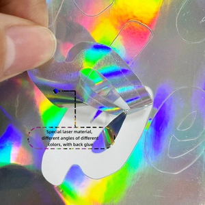 Detail of holographic wall sticker showing color shift and adhesive backing on laser material