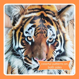 Detailed close-up of double-sided realistic tiger head sticker with vivid orange fur