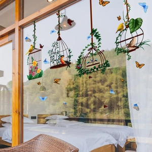 Détail d'autocollants de cage à oiseaux et papillons pour vitres de maison