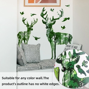Detail of forest elk wall sticker with tree silhouettes and birds on a corner wall