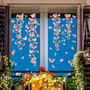 Static cling window film with pink cherry blossom branches and butterflies for glass decor
