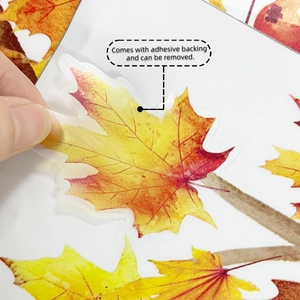 Detail of peelable autumn maple leaf wall sticker with adhesive backing for easy removal