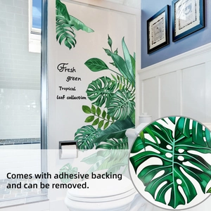 Detail of tropical monstera leaf wall decal with self-adhesive backing for bathroom