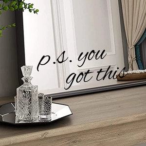Detail of p.s. you got this black lettering sticker applied on a modern dressing mirror