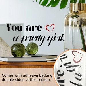 Detail of self-adhesive mirror sticker with You are a pretty girl motivational text