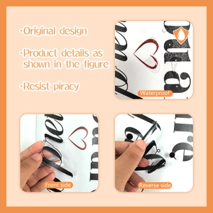 Detail of waterproof wall stickers showing double-sided view with heart pattern and cursive text