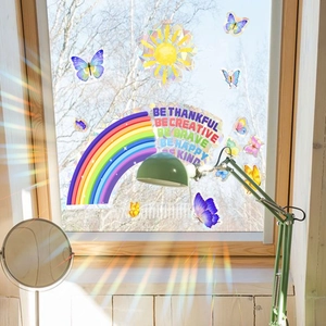Rainbow butterfly window cling detail showing prism light refraction on sunny glass