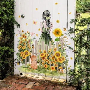 Girl and sunflowers wall decal featuring a garden fence and cat on a white door