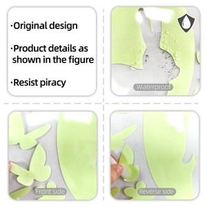 Detail of waterproof luminous rabbit and butterfly wall stickers showing adhesive backing