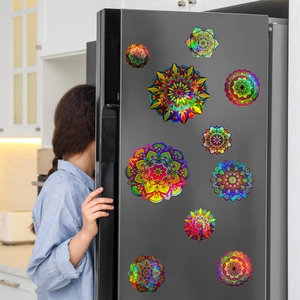 Holographic mandala wall stickers with colorful gradient patterns on black refrigerator