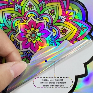 Close-up of iridescent laser mandala wall sticker showing flexible adhesive backing