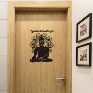 Detail of Buddha and Mandala wall sticker on door with Let the trouble go quote