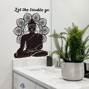 Detail view of Buddha mandala wall sticker with Let the trouble go text in bathroom