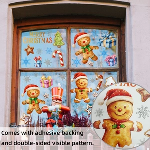 Close-up of adhesive Christmas window stickers showing gingerbread man and snowflake details