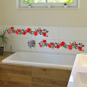 Detail view of red rose and black vine wall decals applied on bathroom marble tiles