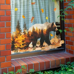 Autumn brown bear silhouette window sticker with pine forest pattern and falling leaves