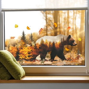 Static cling window decal featuring brown bear silhouette with autumn forest landscape