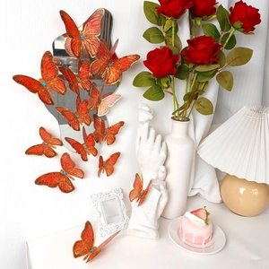 Red 3D butterfly wall stickers with gold edges and blue gems for home decoration