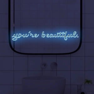 Luminous blue 'you're beautiful' neon wall sign for modern home interior decor