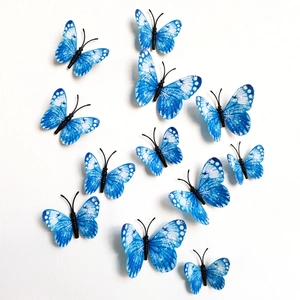 Detailed view of 12 blue and white snowflake 3D butterfly wall stickers in varied sizes