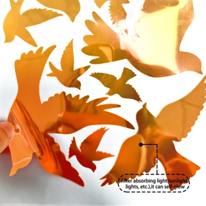 Luminous orange bird wall stickers with metallic mirror finish and self-glow effect