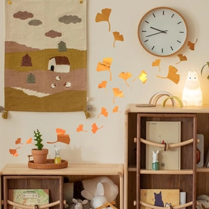 Luminous ginkgo leaf wall decals with orange glowing effect for cozy home decoration