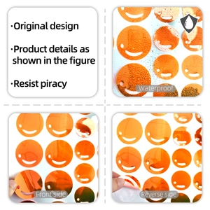 Waterproof orange glow-in-the-dark smiley face wall stickers with self-adhesive backing