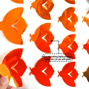 Close-up of DIY orange butterfly wall stickers with self-luminous fluorescent feature