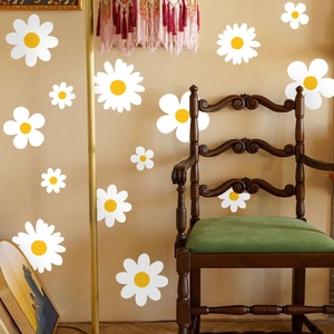 Fresh white daisy flower wall decals on vintage indoor wall with retro wooden chair decor