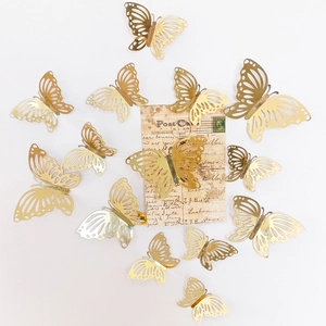 Detailed view of hollow gold metallic 3D butterflies with diverse wing textures on white