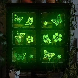 Luminous green butterfly and flower wall stickers set with glowing effect in dark