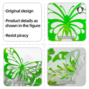 Close-up of waterproof butterfly wall sticker with green reflective surface and adhesive back