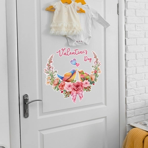 Detail of Valentine's Day wall sticker with pink roses and birds on a white wooden door