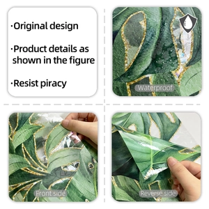 Detail of waterproof tropical leaf window film with golden outlines and embossed texture