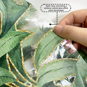 Macro detail of tropical palm leaf window film with rainbow static cling effect