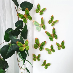 Detailed view of 3D green butterflies with gold edges and holographic effect wall decor