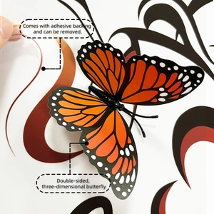 Macro view showing 3D double-layer orange butterfly wall stickers with adhesive backing